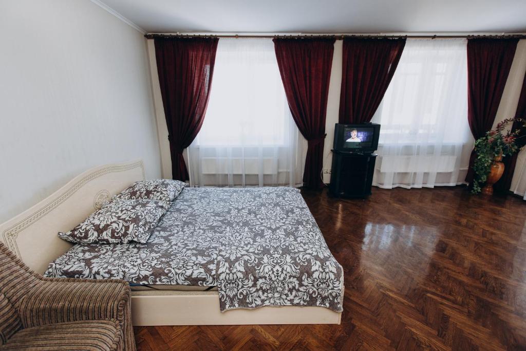 Postel nebo postele na pokoji v ubytování Apartment Centr neer Manufaktura on Kharkovskaya