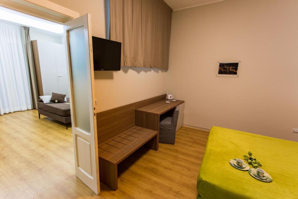 Televízia a/alebo spoločenská miestnosť v ubytovaní Le Affacciate Bruzie Home Guest House
