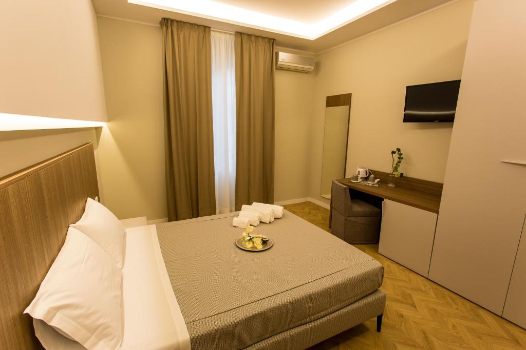 Televízia a/alebo spoločenská miestnosť v ubytovaní Le Affacciate Bruzie Home Guest House