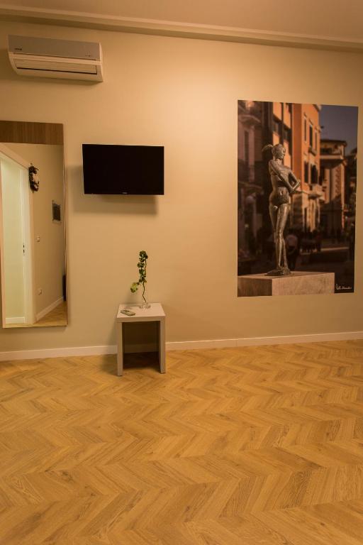 Televízia a/alebo spoločenská miestnosť v ubytovaní Le Affacciate Bruzie Home Guest House