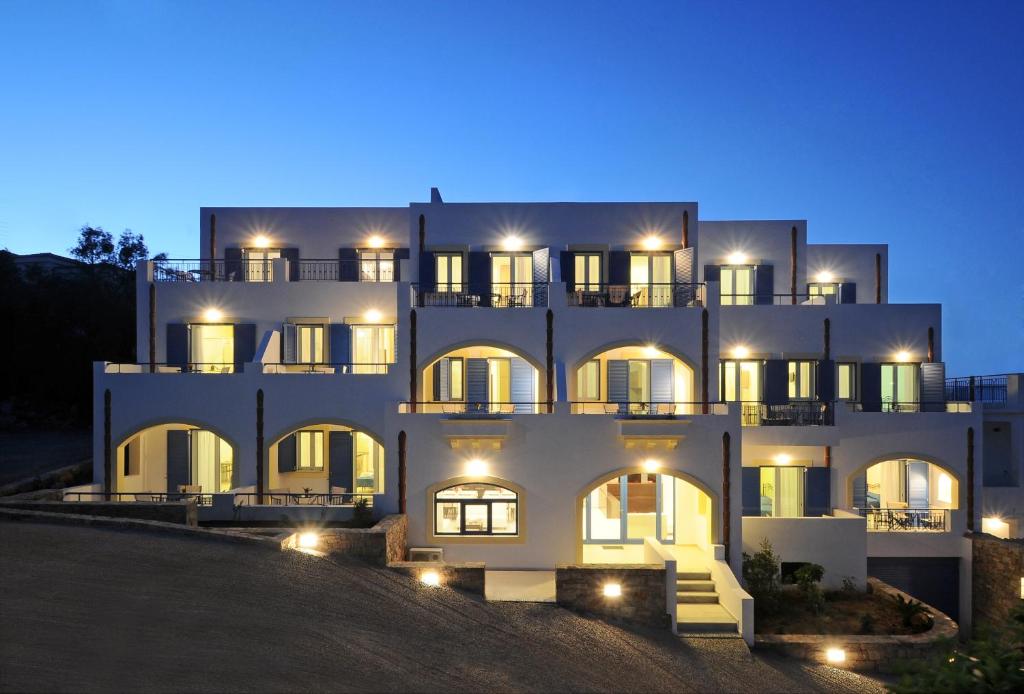 a large white building at night with lights at Anatoli in Agia Pelagia Kythira