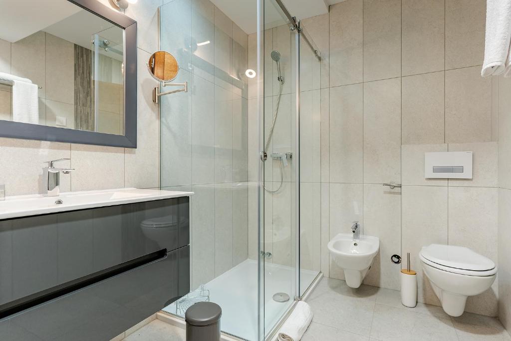 Koupelna v ubytování Rubicon Garni Hotel