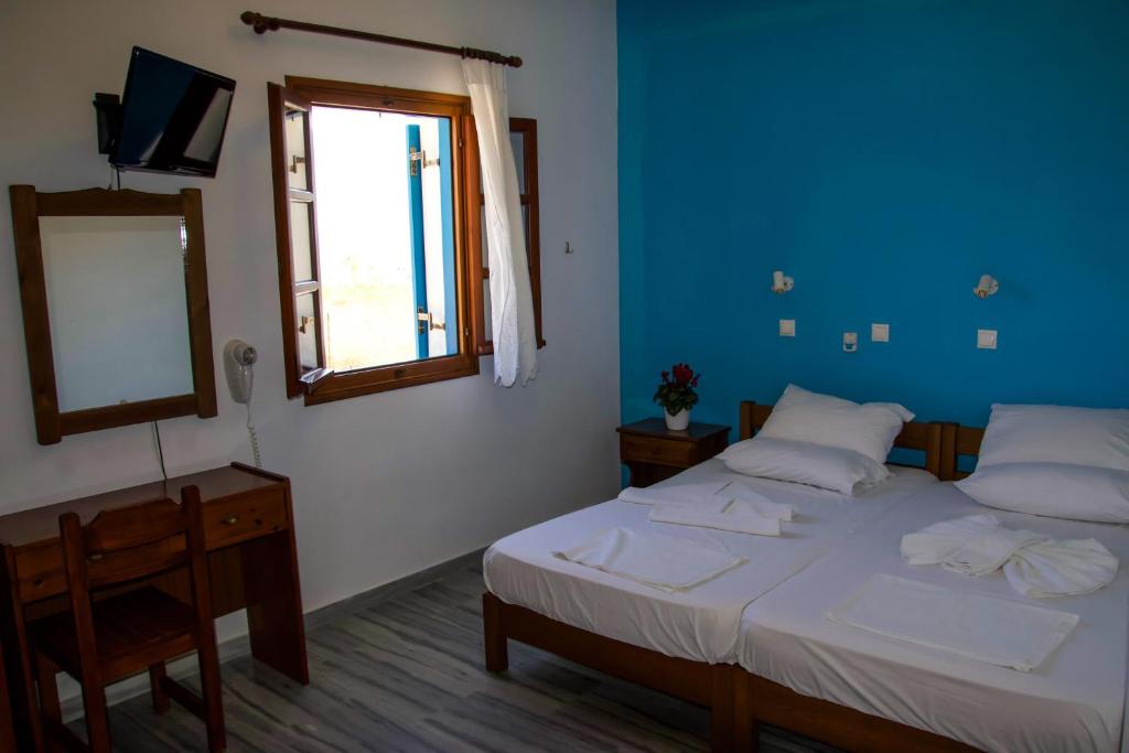 Postel nebo postele na pokoji v ubytování Ioanna Rooms
