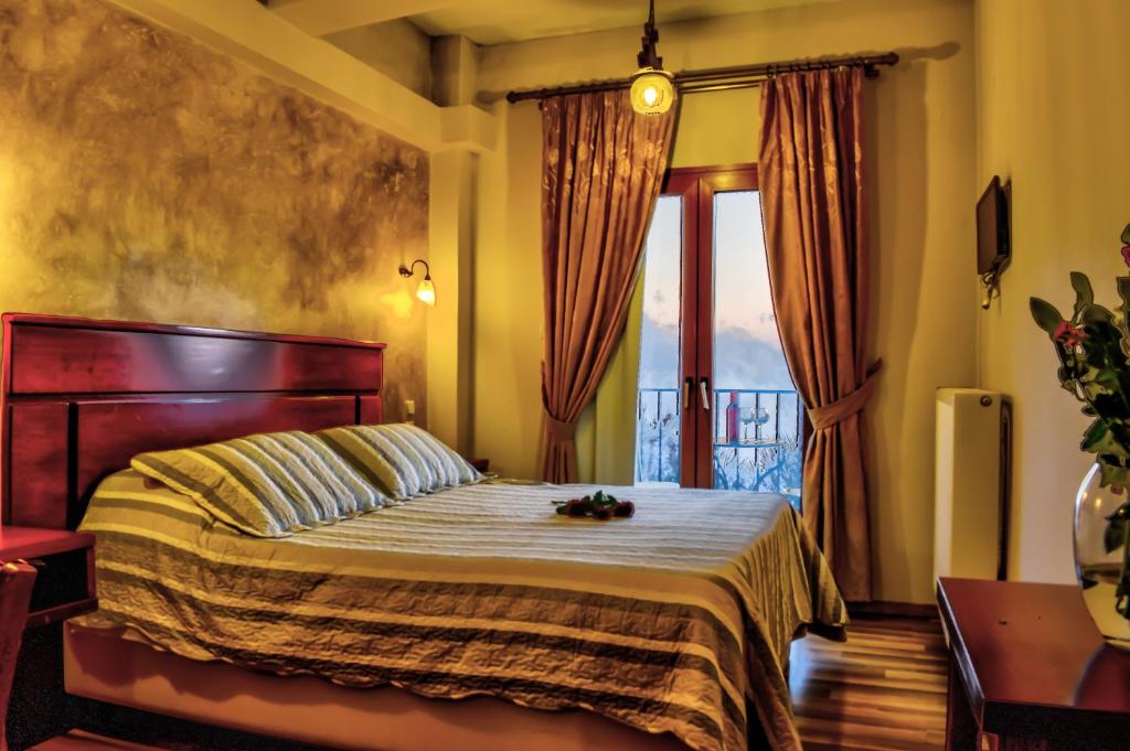 Posteľ alebo postele v izbe v ubytovaní Tasia Mountain Hotel