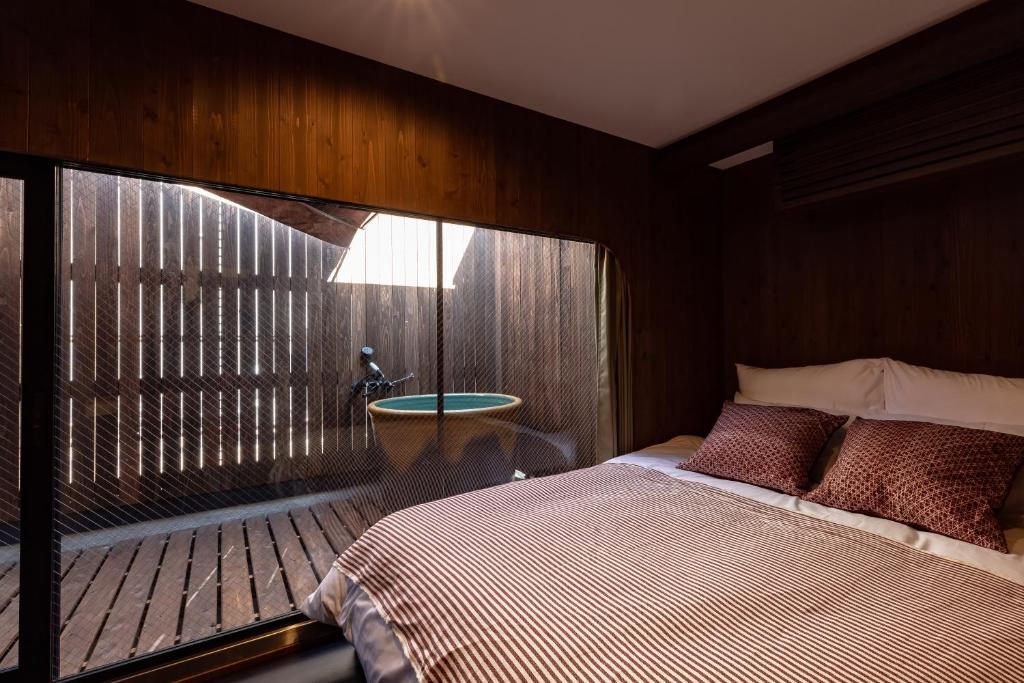 Кровать или кровати в номере Urban Inn Sun rise