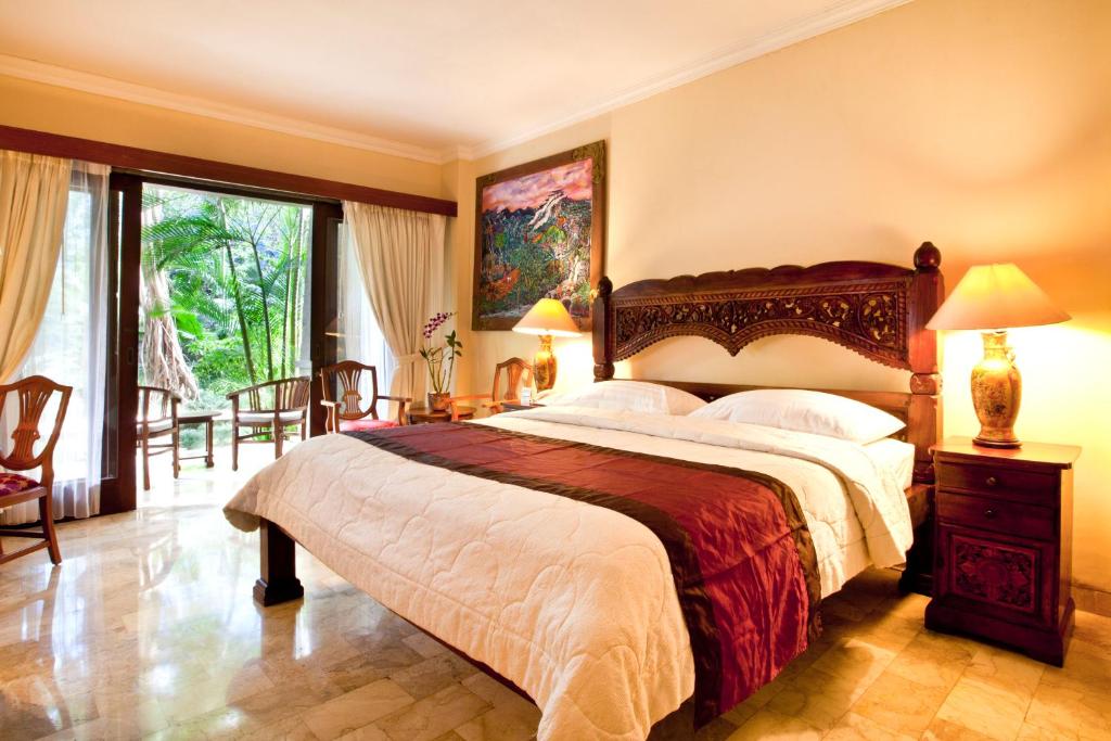 Postel nebo postele na pokoji v ubytování Hotel Kumala Pantai