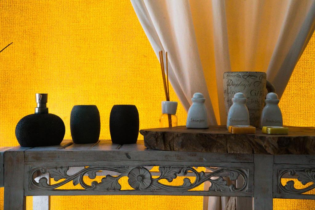 a group of vases sitting on top of a table at Glamping Canonici di San Marco in Mirano