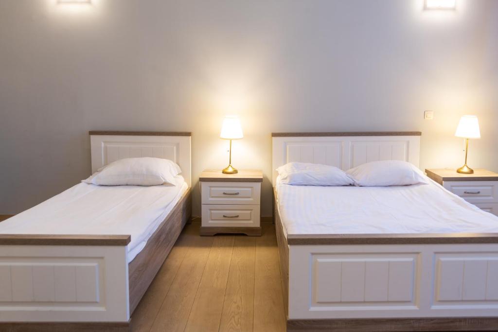 Postel nebo postele na pokoji v ubytování Wellness Apart Hotel