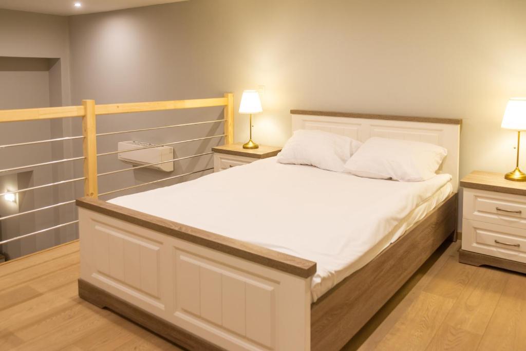 Postel nebo postele na pokoji v ubytování Wellness Apart Hotel