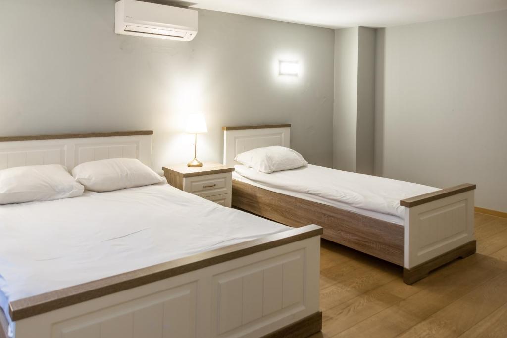 Postel nebo postele na pokoji v ubytování Wellness Apart Hotel