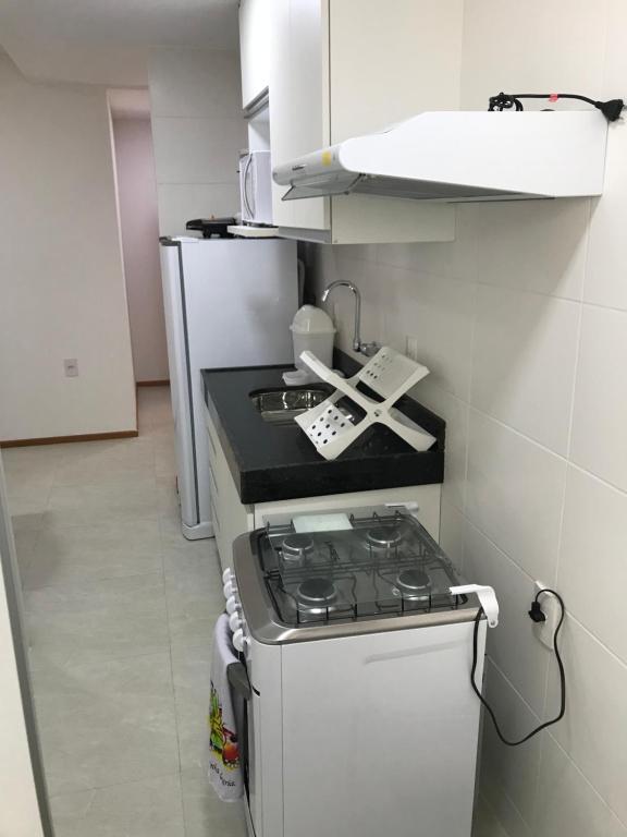 Kuchyň nebo kuchyňský kout v ubytování Apartamento Completo Jatiúca