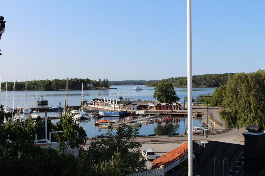 a view of a marina with boats in the water at Vaxholm Seaview Cottage in Vaxholm
