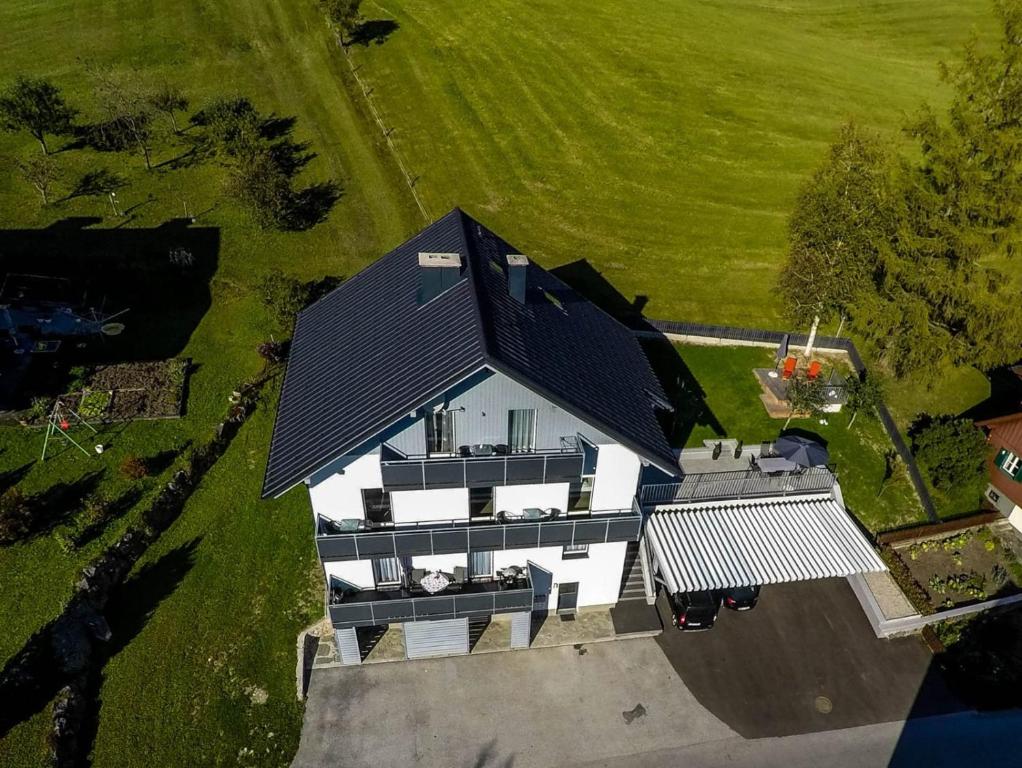 an overhead view of a house with a black roof at Haus Brunner in Bad Mitterndorf