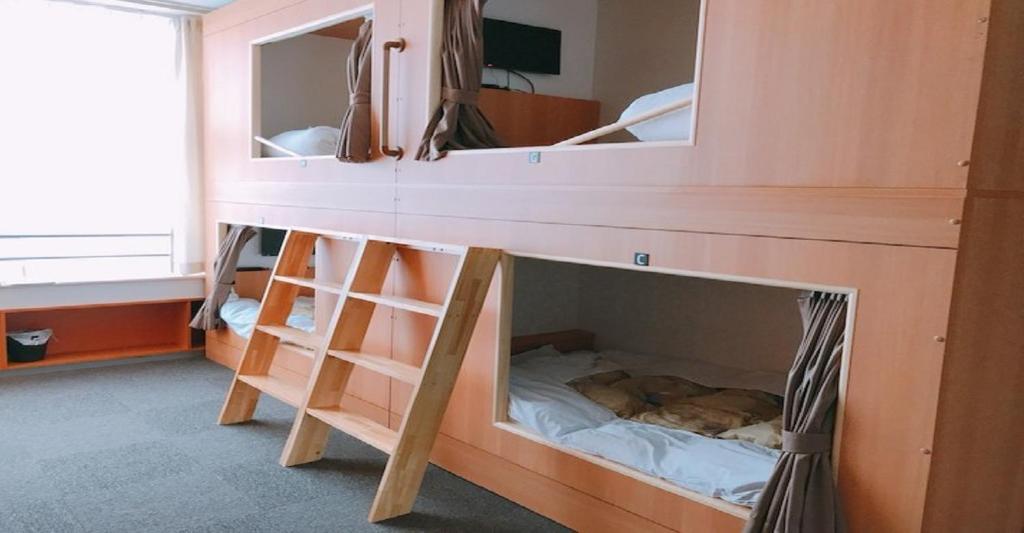 a bedroom with a bunk bed with a mirror at KIBOTCHA / Vacation STAY 8351 in Higashimatsushima