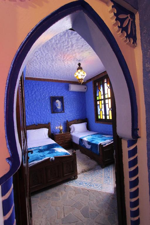 Postel nebo postele na pokoji v ubytování Résidence Hoteliére Chez Aziz