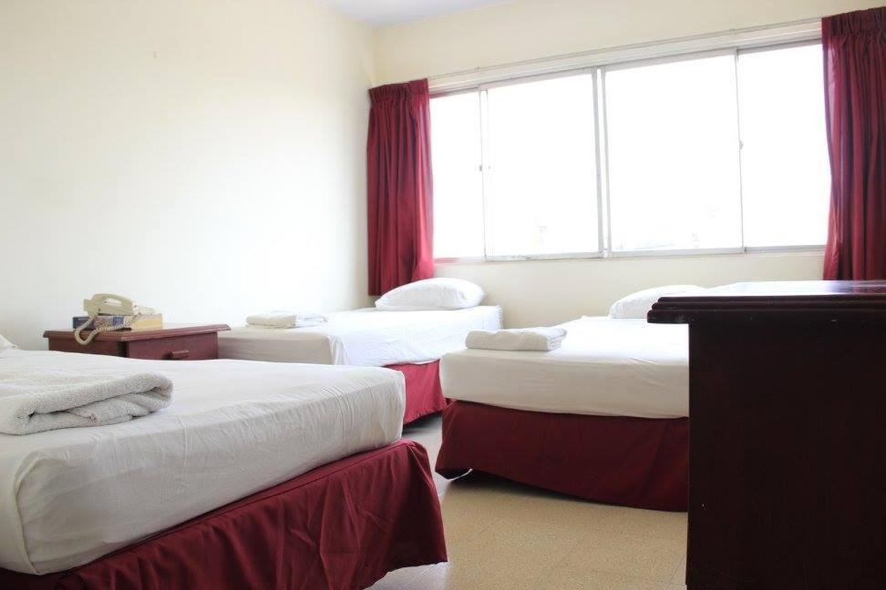 Postel nebo postele na pokoji v ubytování Hotel Doral