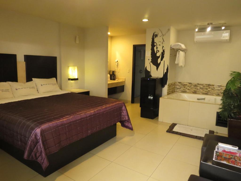 Postel nebo postele na pokoji v ubytování Hotel Velario