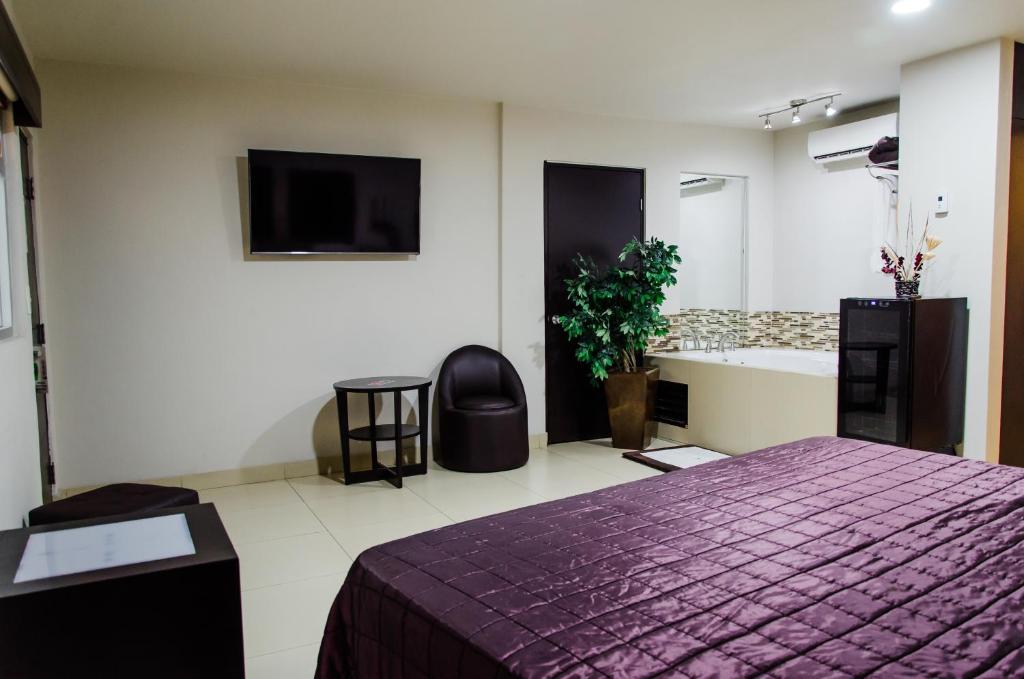 Postel nebo postele na pokoji v ubytování Hotel Velario