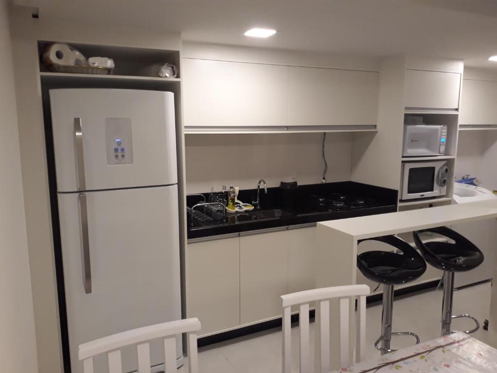 Kuchyň nebo kuchyňský kout v ubytování Apt Interiro Praia de Itapema