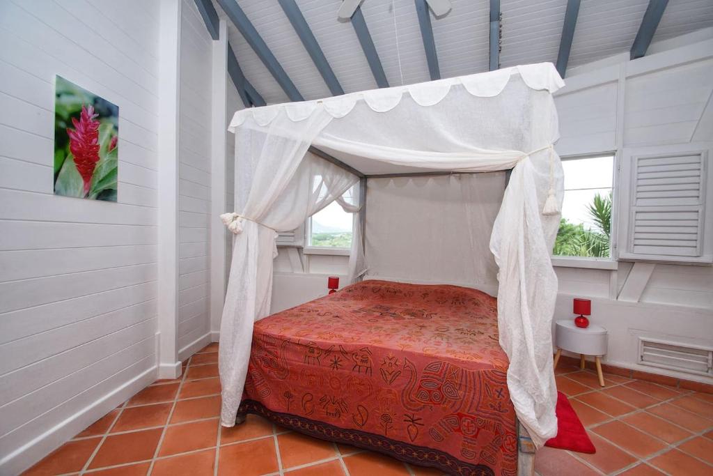 Postel nebo postele na pokoji v ubytování Villa du Cap Beauchene