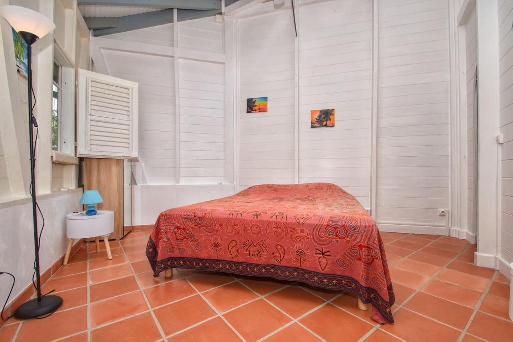 Postel nebo postele na pokoji v ubytování Villa du Cap Beauchene