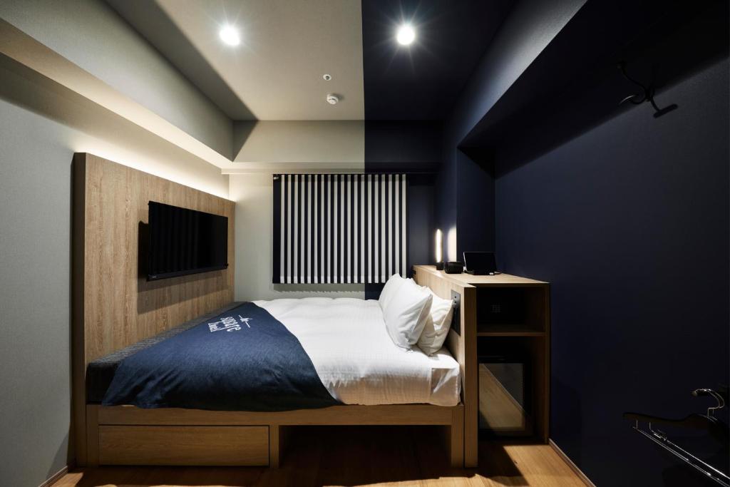 Postel nebo postele na pokoji v ubytování the square hotel GINZA