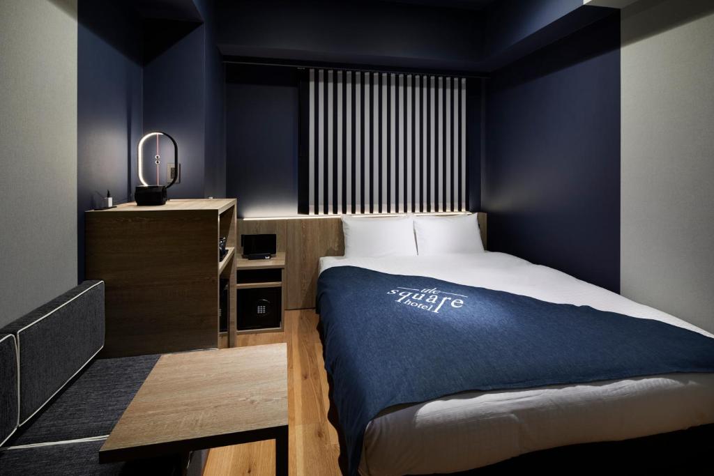 Postel nebo postele na pokoji v ubytování the square hotel GINZA
