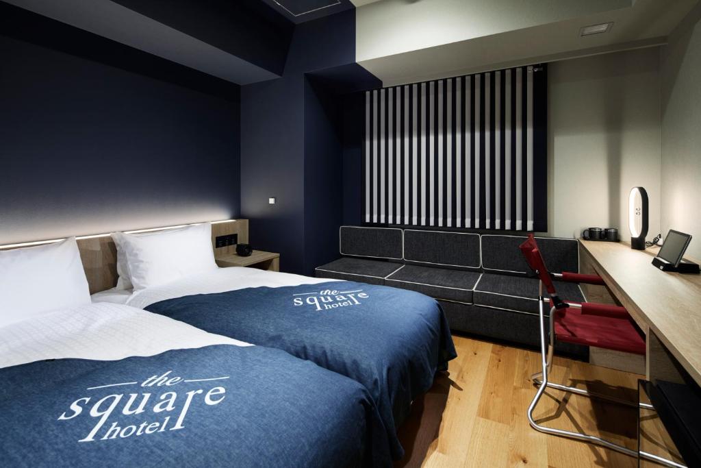 Postel nebo postele na pokoji v ubytování the square hotel GINZA