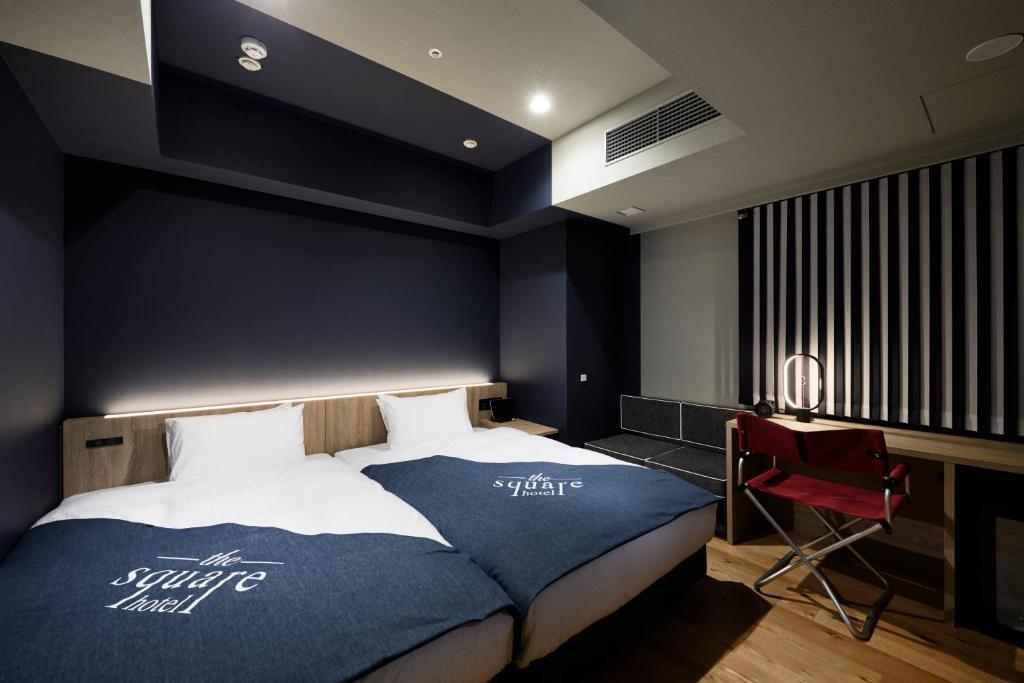 Postel nebo postele na pokoji v ubytování the square hotel GINZA