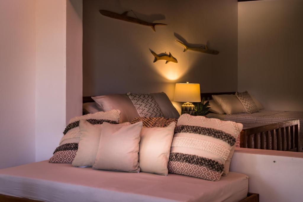 Postel nebo postele na pokoji v ubytování Nosara Beach Hotel