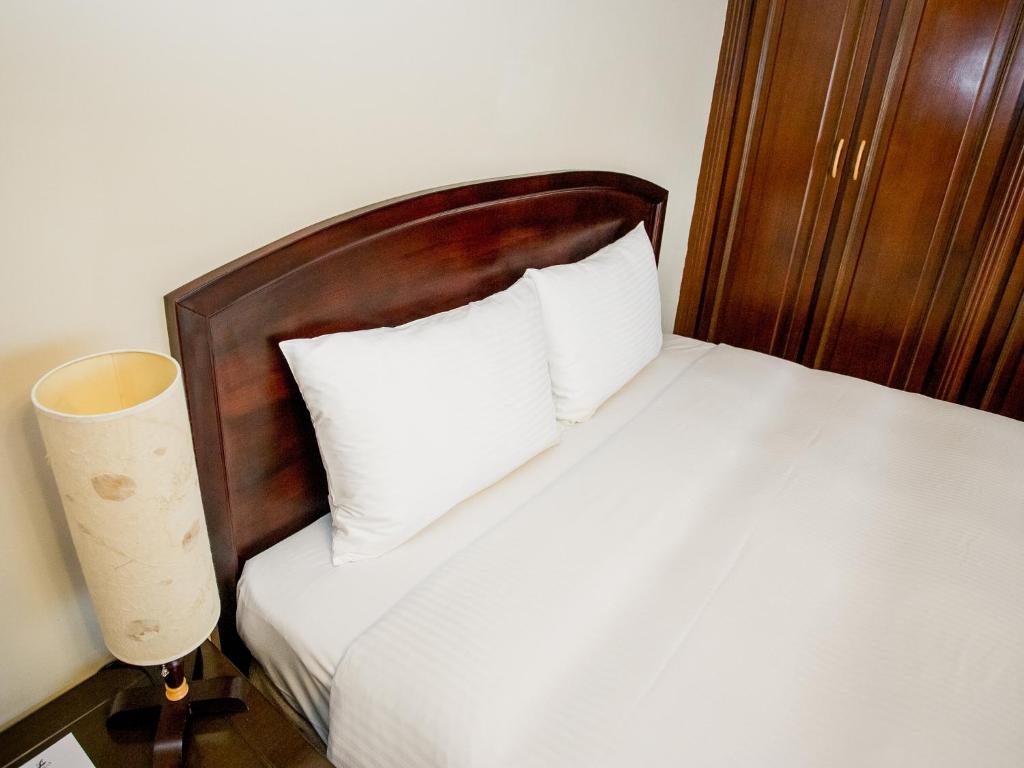 Letto o letti in una camera di Jiuwu Hotel