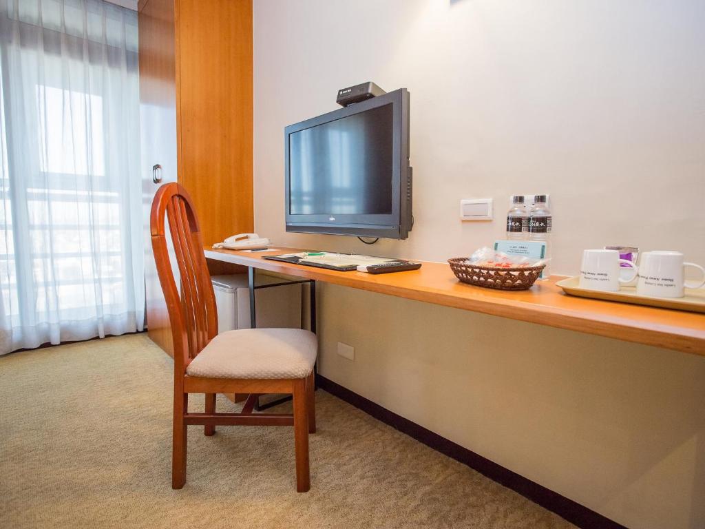 TV o dispositivi per l'intrattenimento presso Jiuwu Hotel