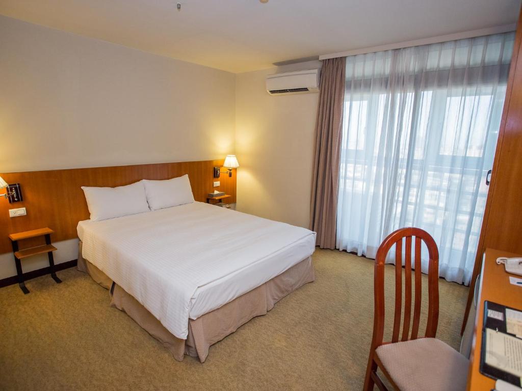 Letto o letti in una camera di Jiuwu Hotel