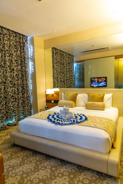 Postel nebo postele na pokoji v ubytování Hotel H2O