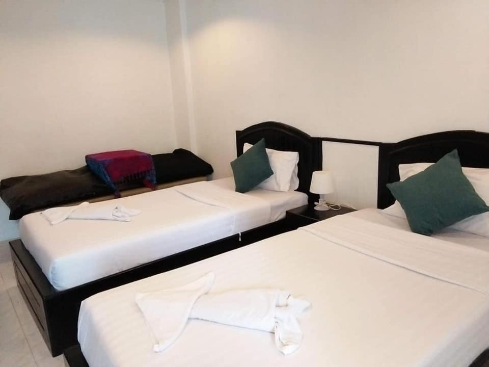 En eller flere senger på et rom på SP Place Hotel