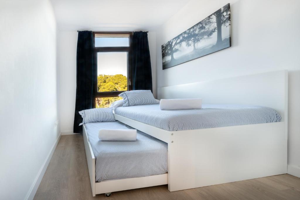 Postel nebo postele na pokoji v ubytování Agaró Cambrils Apartments