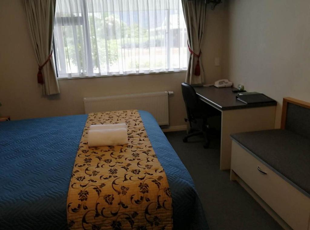 Postel nebo postele na pokoji v ubytování High Peaks Hotel