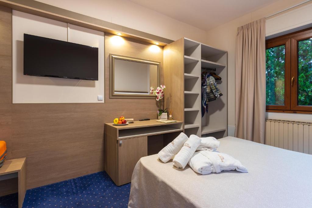 Postel nebo postele na pokoji v ubytování Hotel Aurora