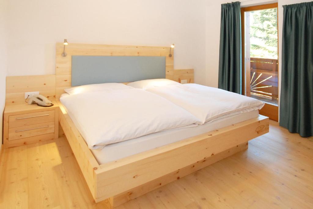 Postel nebo postele na pokoji v ubytování Hotel Feldrand