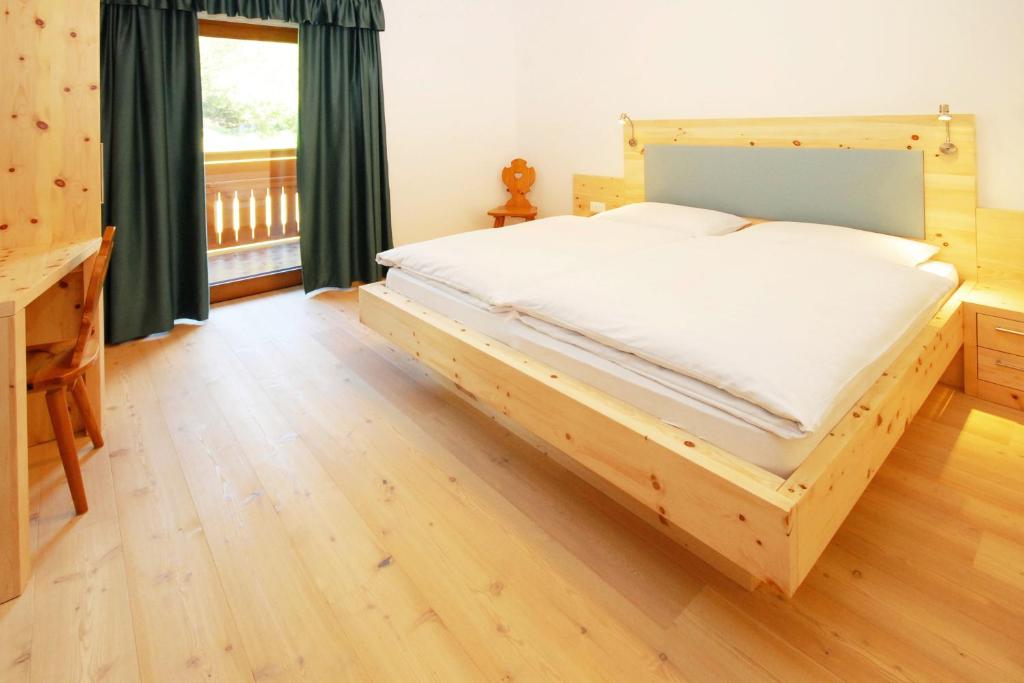 Postel nebo postele na pokoji v ubytování Hotel Feldrand