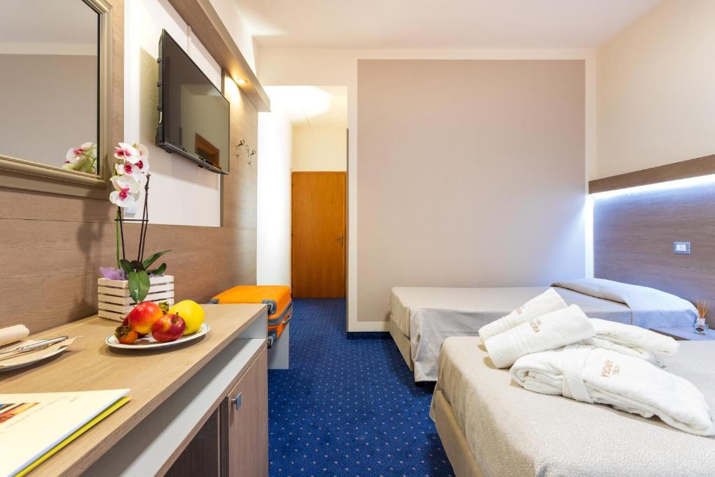 Postel nebo postele na pokoji v ubytování Hotel Aurora