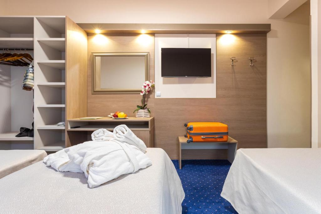 Postel nebo postele na pokoji v ubytování Hotel Aurora