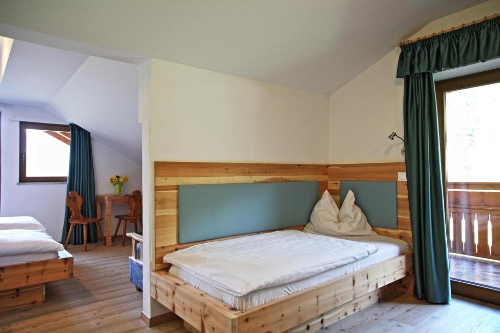 Postel nebo postele na pokoji v ubytování Hotel Feldrand