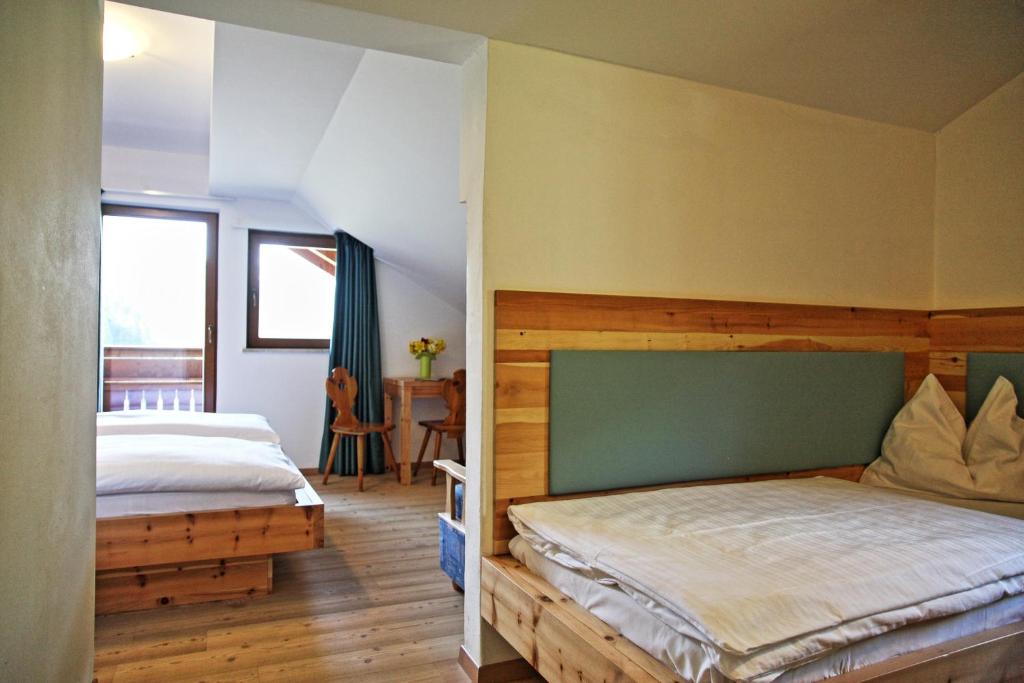 Postel nebo postele na pokoji v ubytování Hotel Feldrand