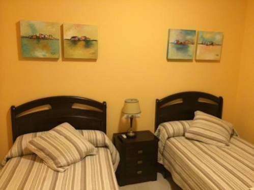 Postel nebo postele na pokoji v ubytování Hostal el mirador
