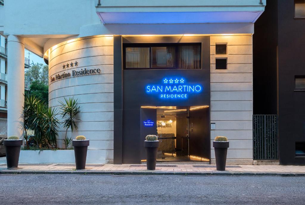 a building with a sign that reads san marino residence at Residence San Martino in Messina