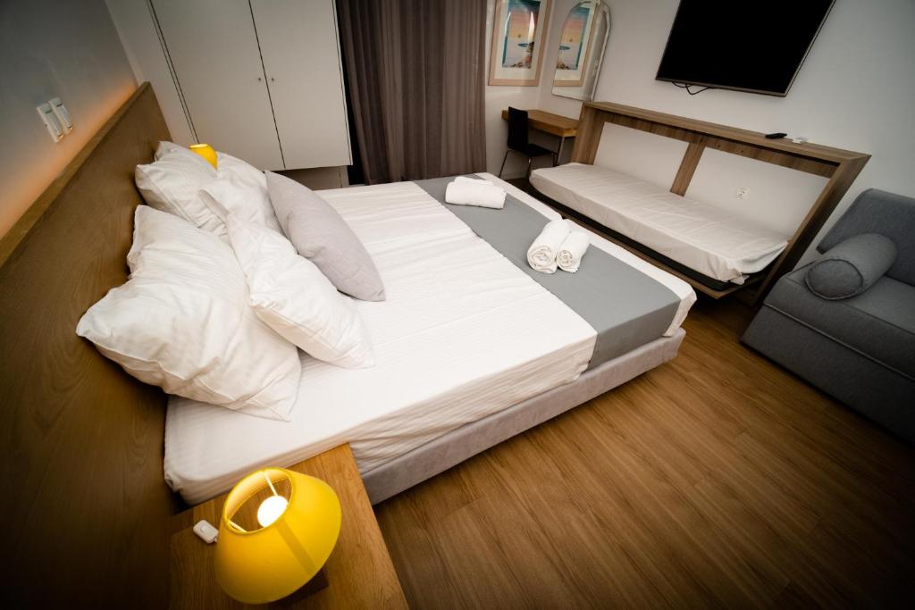 Posteľ alebo postele v izbe v ubytovaní Sappho Studios