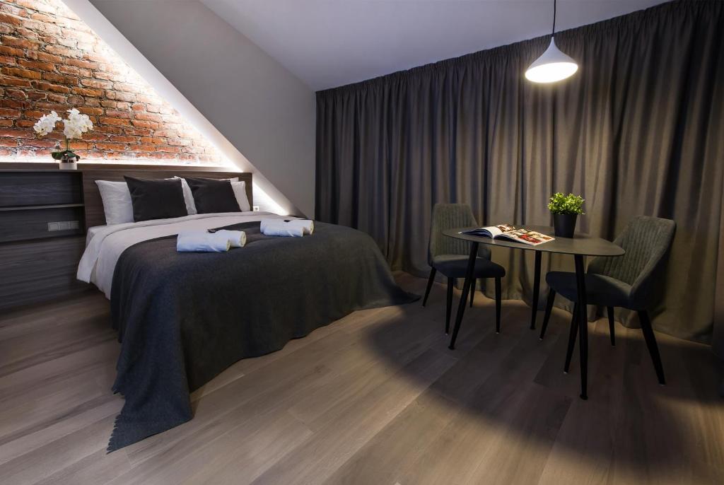 Postel nebo postele na pokoji v ubytování Dangė Hotel