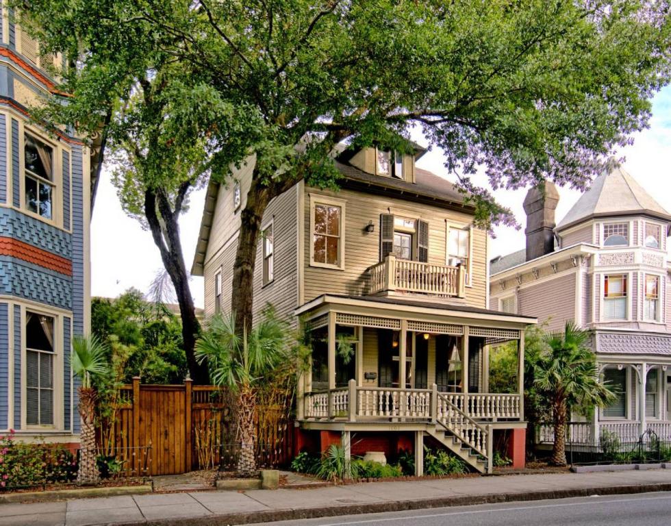 a large house with a porch on a street at The Jepson Estate on Forsyth Park! in Savannah