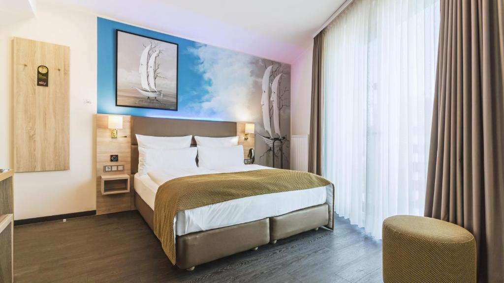 Postel nebo postele na pokoji v ubytování Stay! Hotel Boardinghouse